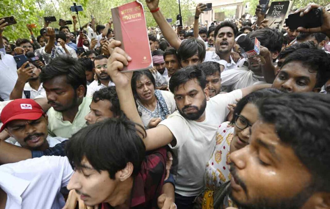 Abhijeet Dipke Jantar Mantar protest, BJP workers assault allegation, Delhi Police, NEET protest, Dharmendra Pradhan resignation, Cockroach Janta Party, paper leak protest, Jantar Mantar news